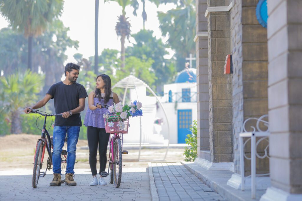 couple cycling together - weddingpur