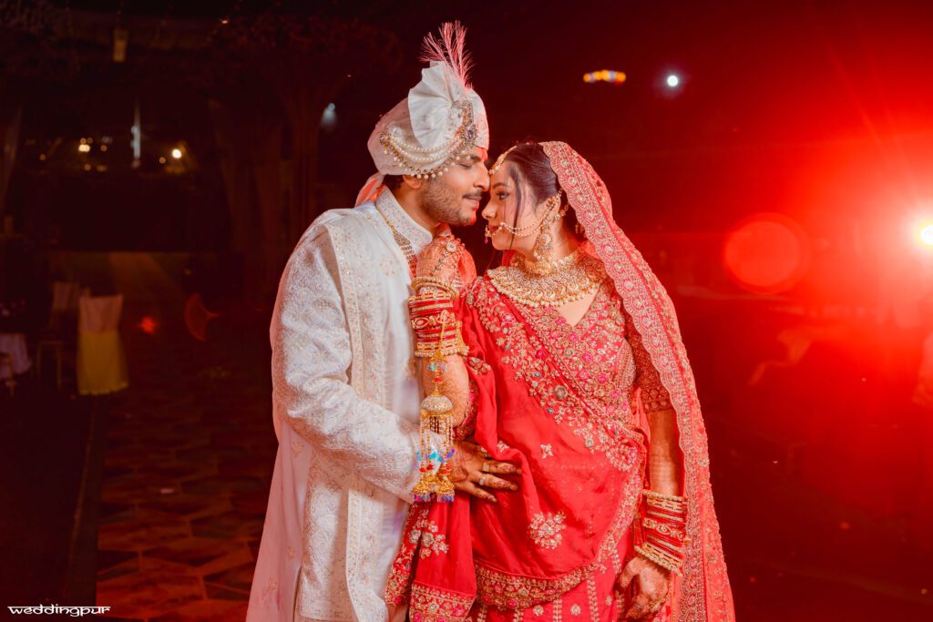 Bride and groom sharing a romantic moment at their traditional wedding in Patna