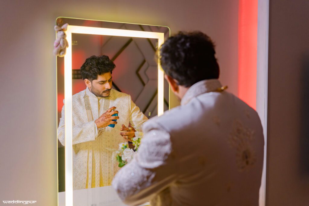 Groom getting ready and applying perfume before his wedding ceremony in Patna